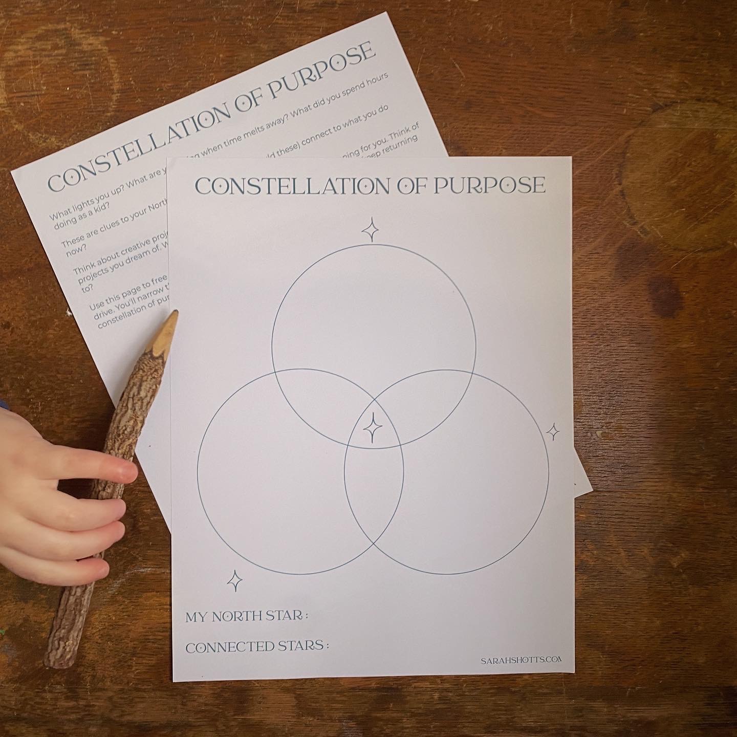 Constellation of Purpose Worksheets with a small hand holding a twig pencil